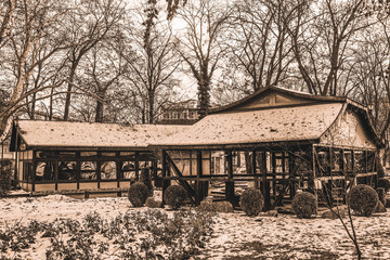 Tecuci, Galati / Romania - 12.18.2019: Casutele din parcul central pe timp de iarna (Vintage houses from central park of Tecuci during winter)
