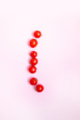 Fresh cherry tomato on soft gentle pink background