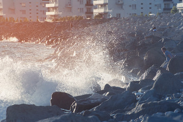 Big waves on the rocky shore near the hotel, Russia, Sochi