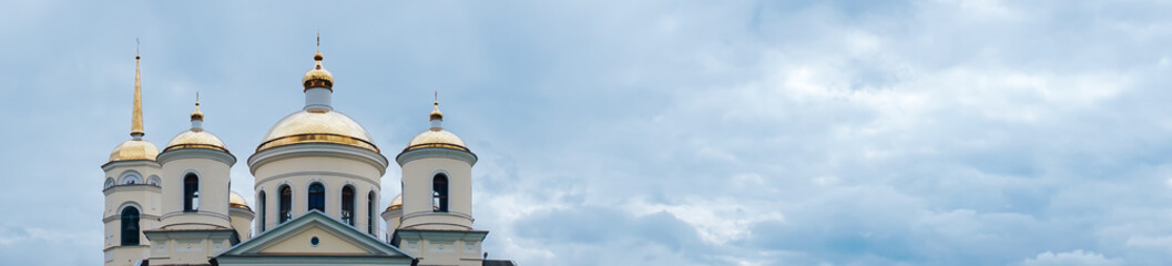 panorama of the church in the blue sky with white clouds