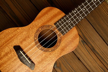 Fototapeta premium Ukulele on wooden background