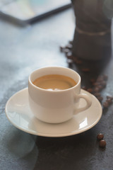 Hot cup of espresso coffee on a table