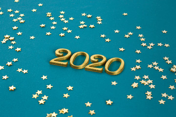Happy New Year 2020. Creative text Happy New Year 2020 written in gold wooden letters.