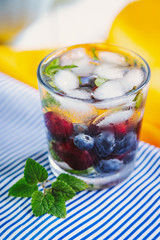 Glass with berries and ice