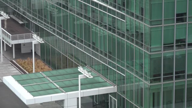 Side of a windowed office building in an urban area