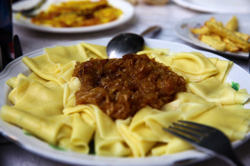 Azerbaijan cusine khingali with fried onions.
