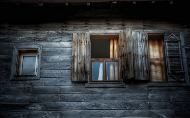 Fototapeta na wymiar An old wooden house wall three windows of an old wooden house, Sozopol, Bulgaria