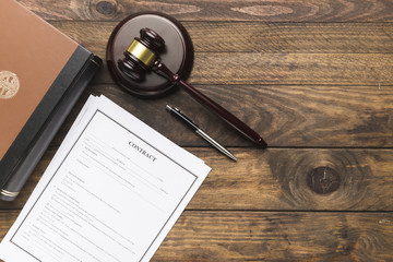 Top view contract, book and judge gavel