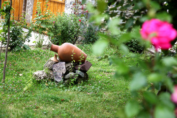  Garden decorated with clay jugs