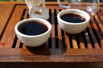 Chinese tea ceremony using tea utensils in nature.