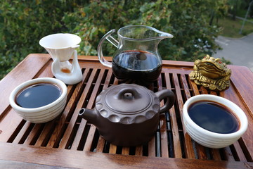 Chinese tea ceremony using tea utensils in nature.