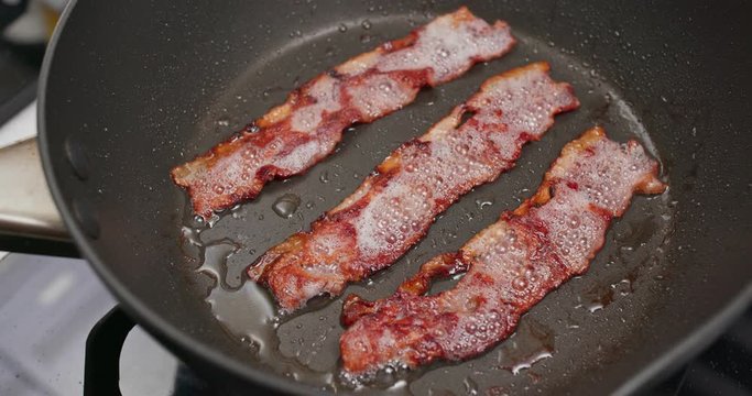 Cooking with bacon on fry pan
