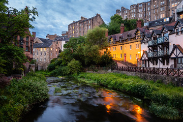 Fototapeta na wymiar Beautiful taditional buildings along the Water of Leith in central Edinburgh at twilight