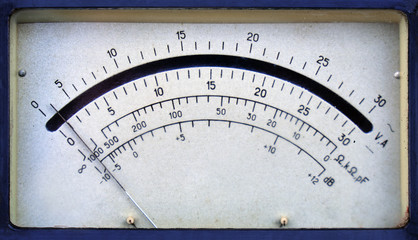 Vintage analog ammeter and voltmeter scale with an arrow