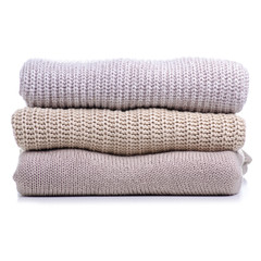 Stack folded sweater clothing on white background isolation