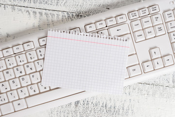 White keyboard office supplies empty rectangle shaped paper reminder wood