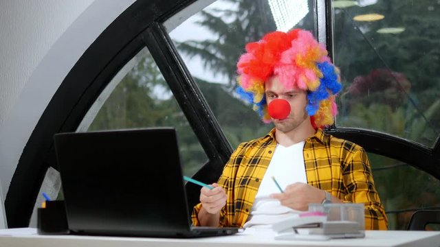 allegory concept, office worker. Clown manager in the office