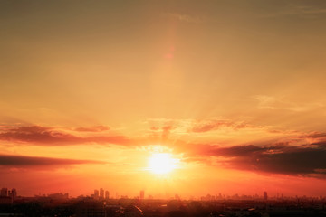 Fototapeta na wymiar Sun rays of sun over building silhouette,At twilight in Bangkok ,Thailand