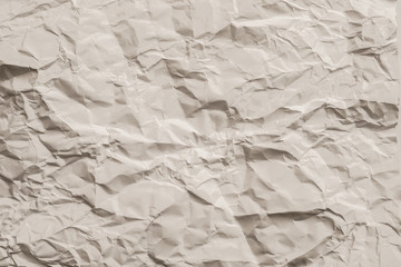Beige crumpled paper. Crushed texture. Stone surface effect decorative layer. Copy space.