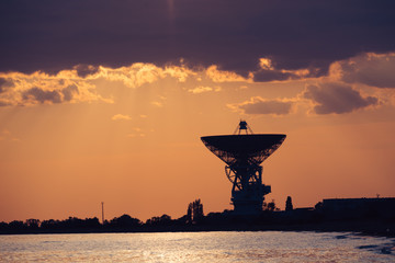 Fototapeta premium Radio telescope R-2500 RT-70 on the background of a beautiful sunset.