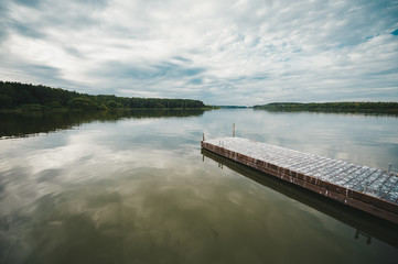 Wooden pier on the lake in the morning