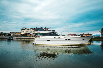 Yacht in the port near the pier.