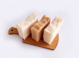 Natural handmade soap on a cutting board on a white background
