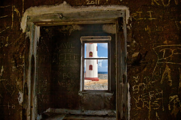 Fototapeta na wymiar View of Spelonk Lighthouse through Ruins of Lighthouse Keeper's House, Bonaire