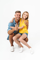 Happy father with his little daughter embracing