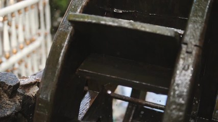 Decorative water wheel in the garden - close up
