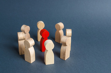 Red human figure surrounded by a circle of people. Leader Boss and leadership. Cooperation and...