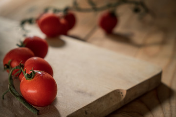 cherry tomatoes on a wooden cutting board