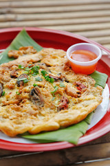 Oyster omelette and spicy sauce in Chinese style