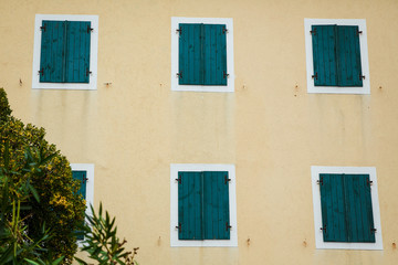 closed identical windows of green color