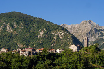 Fototapeta na wymiar Vagli Sopra village with Apuan Alps behind. Garfagnana area of Italy.