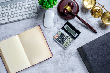 Office lawyer desk with law books,calculator,computer, Judge gavel and scales of justice. Justice...