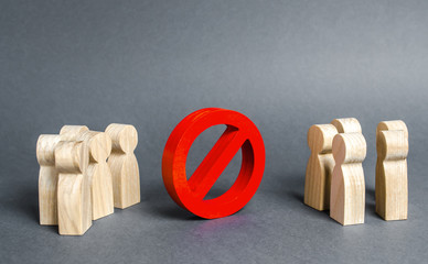 Two groups of people are divided by a red prohibition sign NO. prohibition, taboo, and rejection....