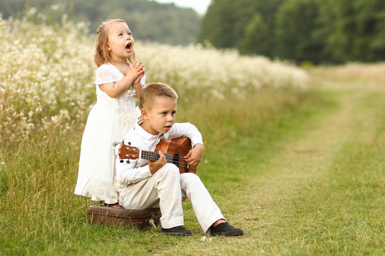 little bride and groom in nature with