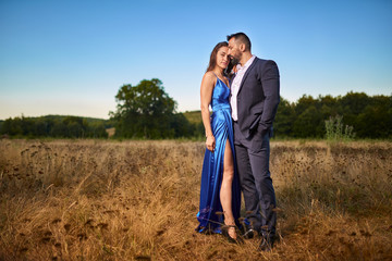 Portrait of a beautiful couple outdoor by the forest
