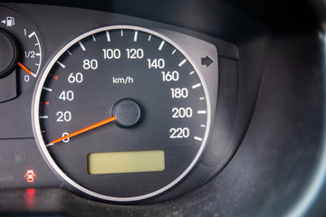 close-up of a dashboard with a speedometer in a car