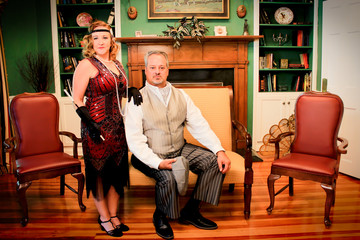 a portrait of a man and woman in 1920's attire