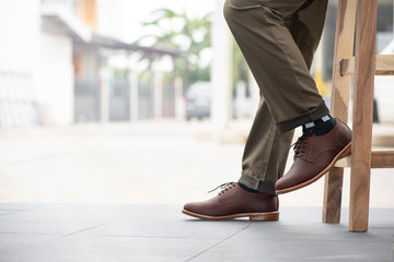 Men fashion with trousers and brown shoes leather for man collection.