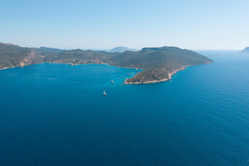 Beautiful scenery from sea to the land. Green hills and mountains shot with drone
