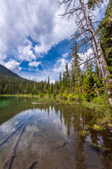 View at Mountain Lake with Dramatic Clouds in British Columbia, Canada.