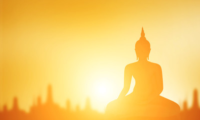Buddha statue,  Silhouette Buddha on golden sunset background, Concept of important days in Buddhism, Visakha Puja Day