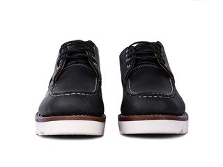 Man fashion close-up a pair of black shoe isolated on a white background. front side
