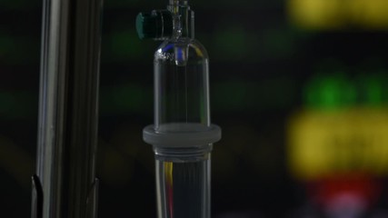 Intravenous fluid in operating room and vital signs monitoring on background