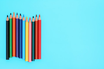 Colored pencils. A set colored pencils isolated on a blue background.