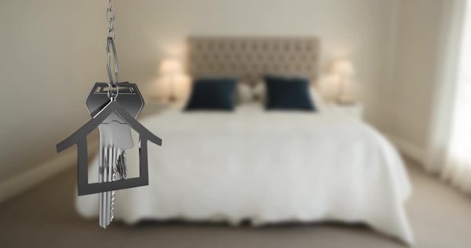 House keys and key fob hanging over out of focus bedroom 4k