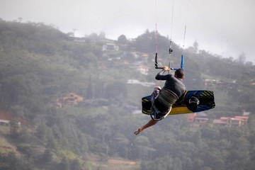Fototapeta na wymiar Kitesurfer jumping 